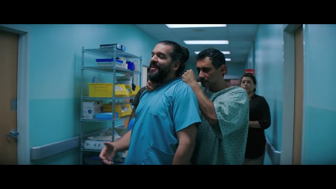 Manousos exiting hospital in Pluribus Episode 8