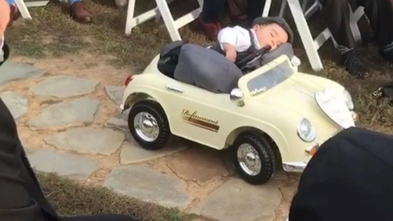 9-Month-Old Ring Bearer Steals The Spotlight as He Sleeps His Way Down The Aisle