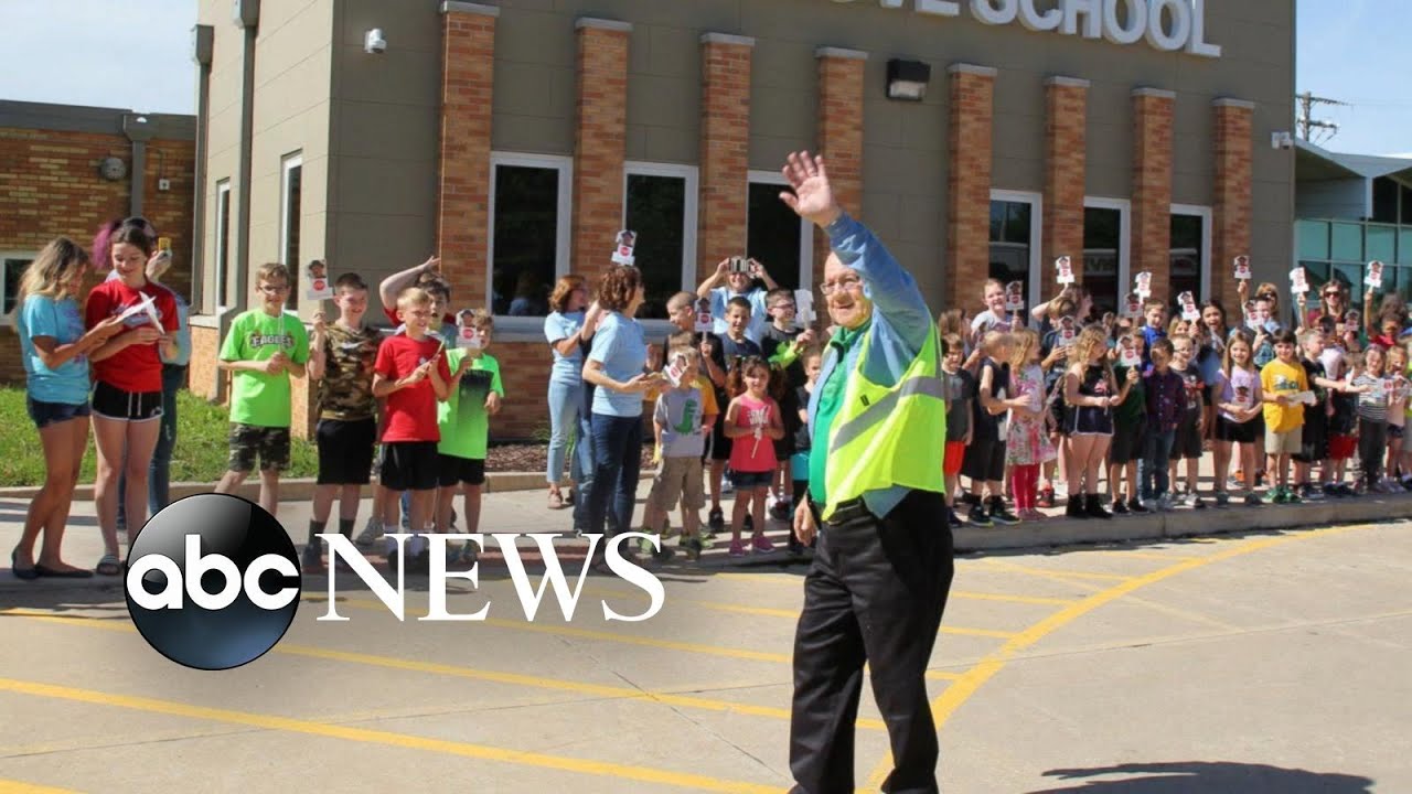 A man who worked as a crossing guard for a school for nearly 7 decades retires