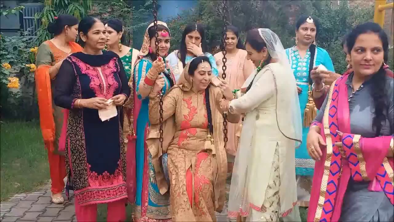 Punjabi Girls and Women Enjoying Dance and rain While Celebration Teej Festival in Punjab