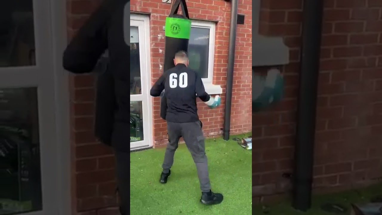 Eamon McAuley  (60) with nephew Brayden hitting the punchbag. 