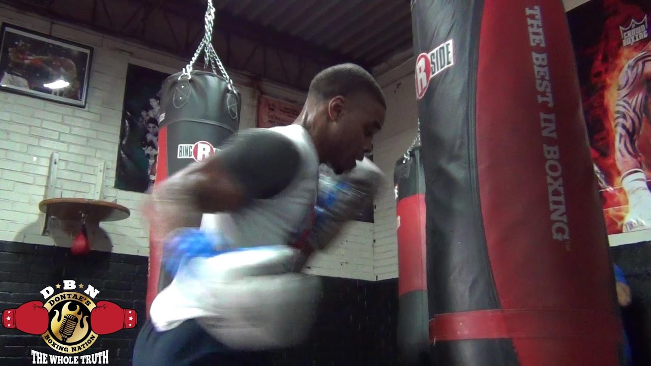 ERROL SPENCE DESTROYING THE HEAVY BAG WITH HOOKS IN PREPARATION  FOR KELL BROOK