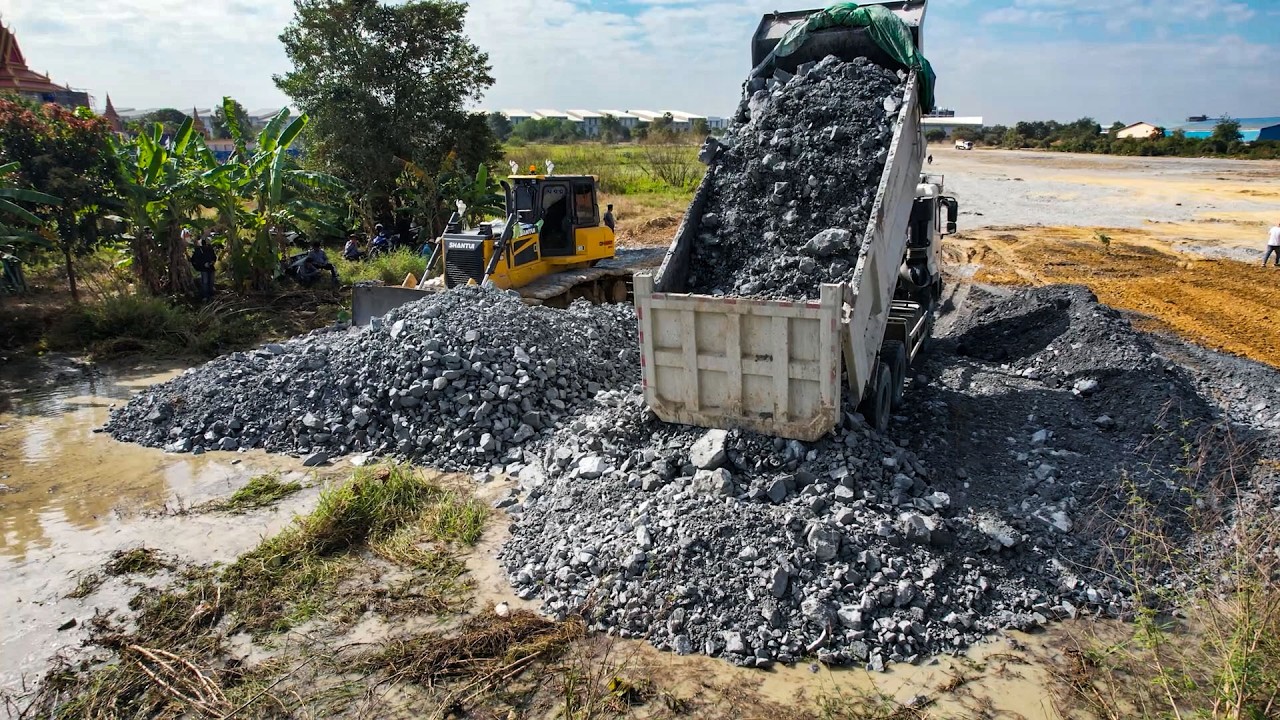 OMG Dump Trucks Filling 12-Wheel Flooded Land By Skilled Using Shantui Using Pushing Stone Over