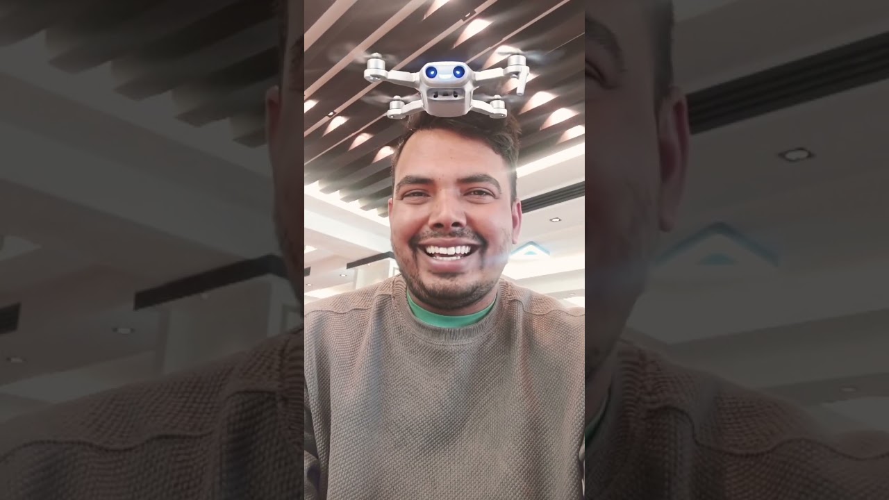 A small, friendly robotic drone flies into the frame and hovers🤪😜