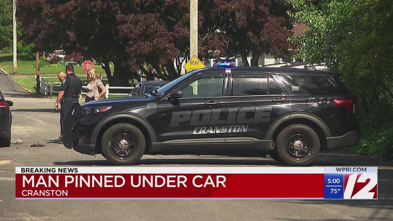 Man rushed to hospital after pinned under car in Cranston