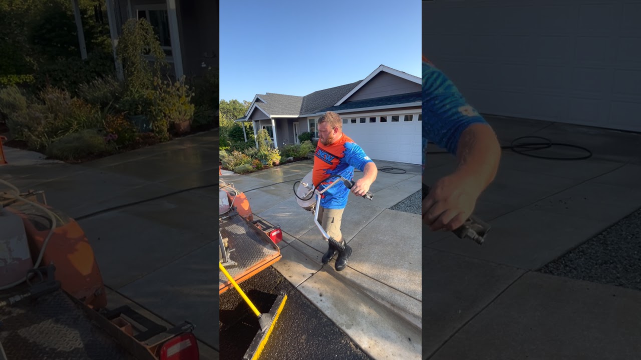 Surface cleaning driveway with F9 groundskeeper, removing tire marks