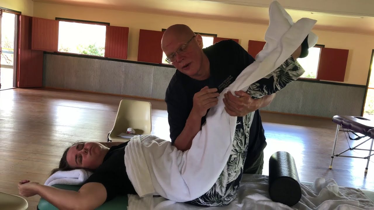 Abdominal massage and assisted abdominal breathing. Naturopath Brandon Raynor demonstrates.