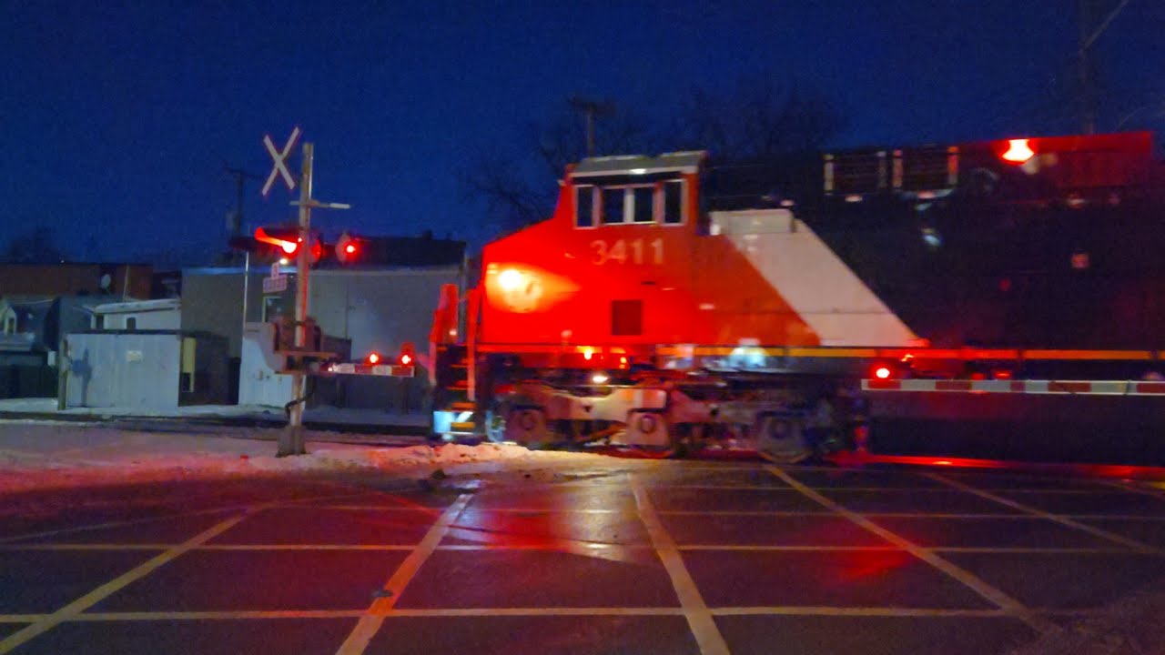 NIGHT TRAINS Winter CN Freight with AC44C6M and CN Logo ES44AC at St Ambroise Street Crossing 
