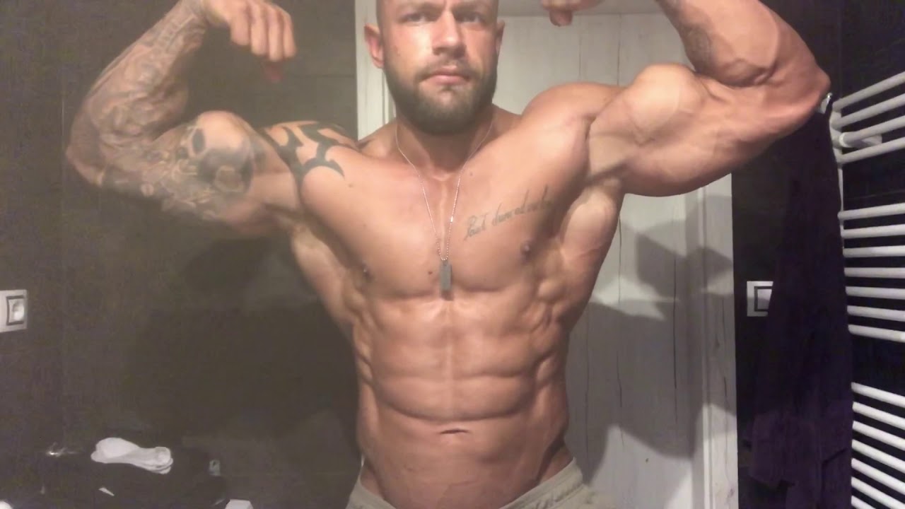 Bodybuilder muscle hunk flex biceps and pecs