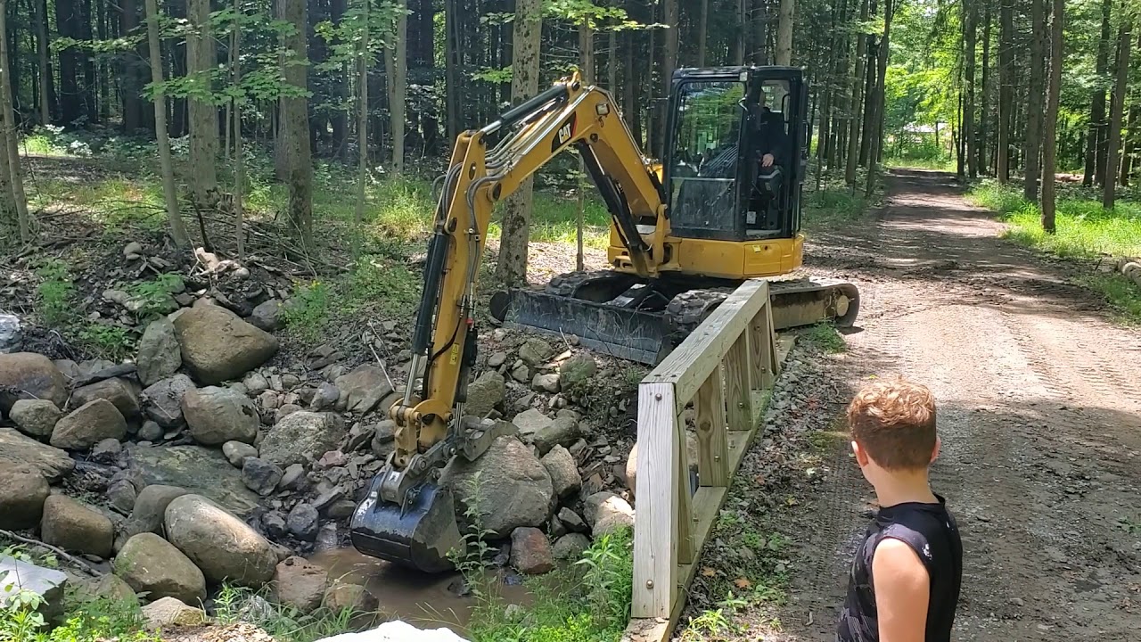 CAT 305.5E2 CR in action at the cabin.