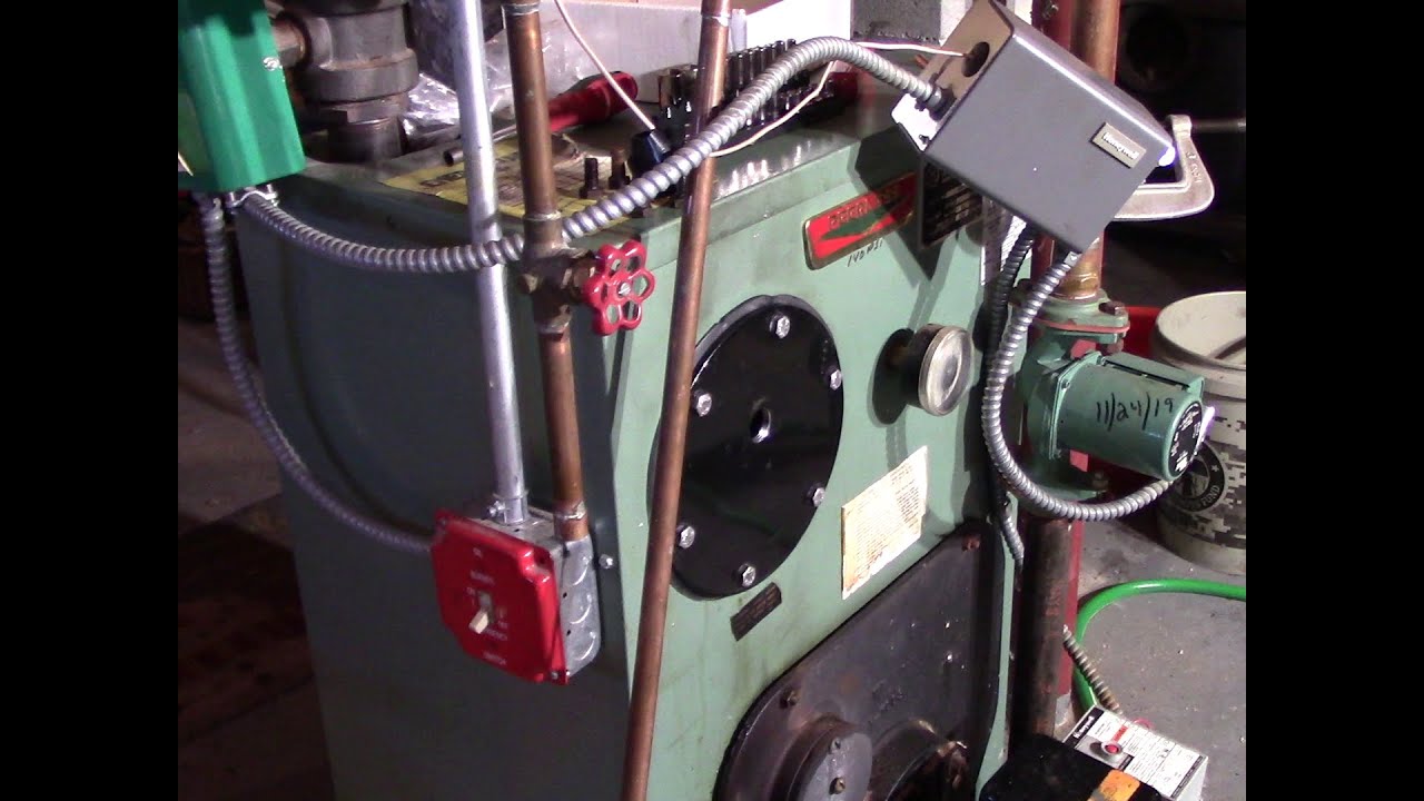 Removing tankless coil from boiler and replacing with blank cover plate