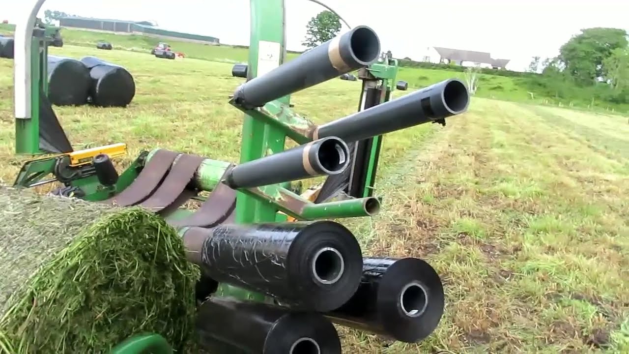 Bale wrapping with a John Deere 2850  and McHale Hs 2000