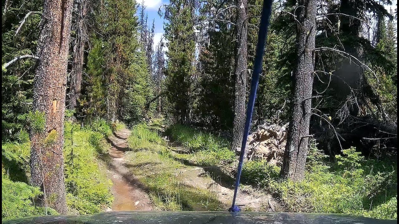 Driving a rugged road to a pristine lake in the wilderness of British Columbia, Canada