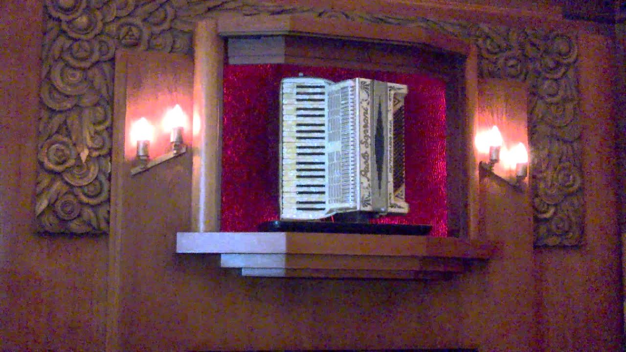 Automated music machine with accordion