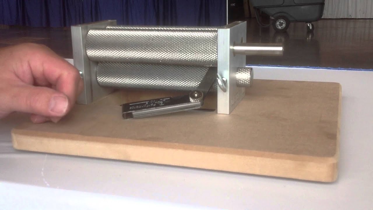 Setting the gap on a three roller Monster Mill.