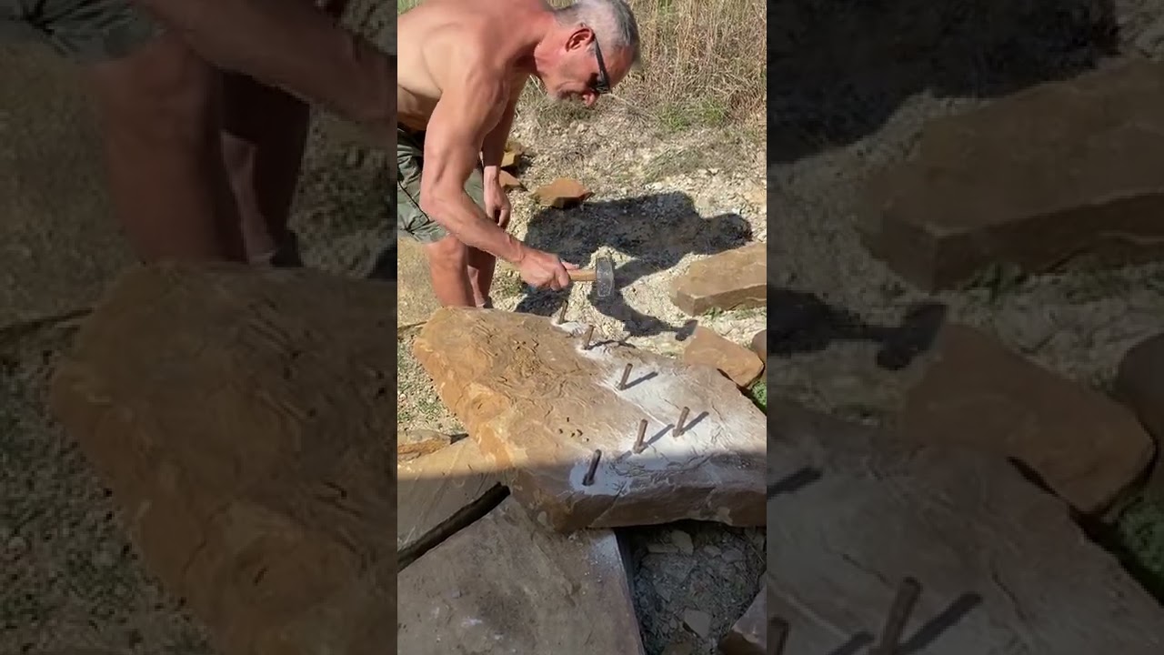 Splitting sandstone with feather and wedge