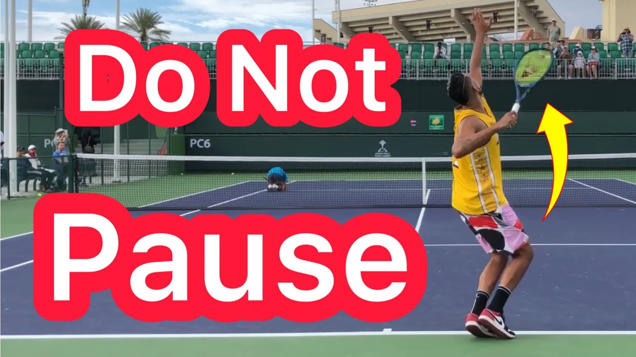 Do NOT Pause During Your Serve’s Trophy Position (Pro Tennis Technique Explained)