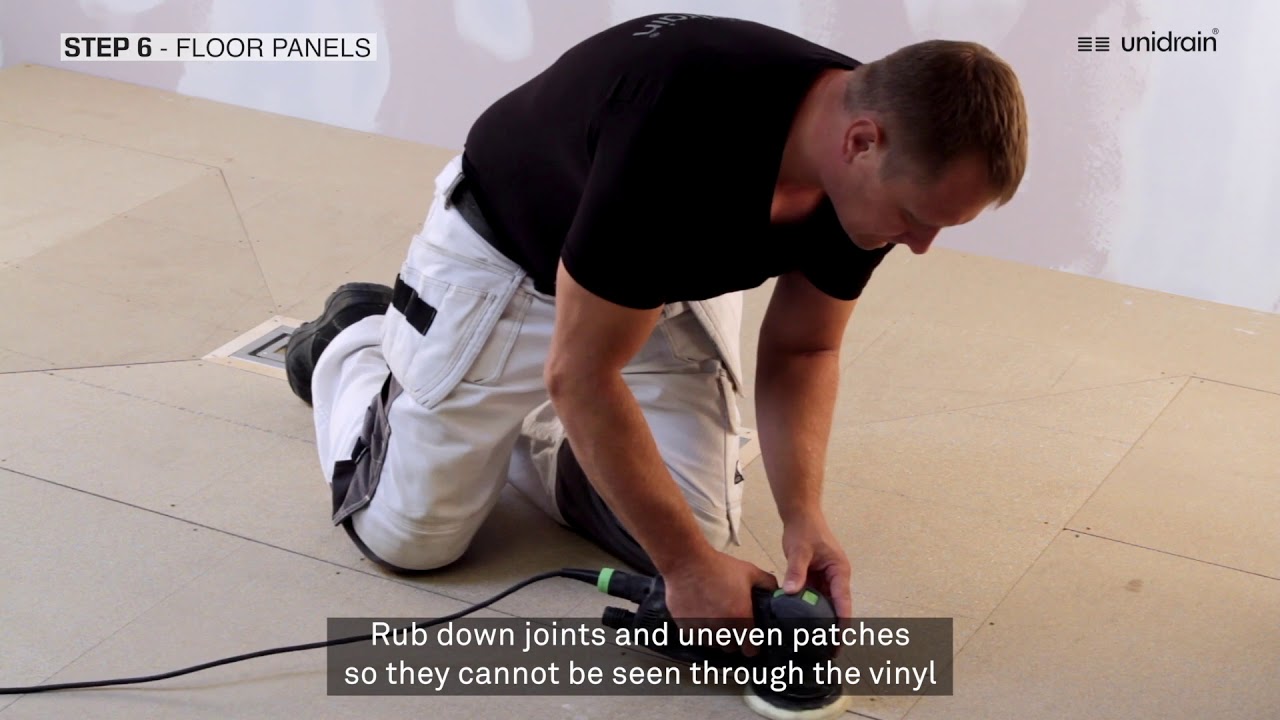 Unidrain Vinyl Wet Room Drain Installation on Wooden Floor