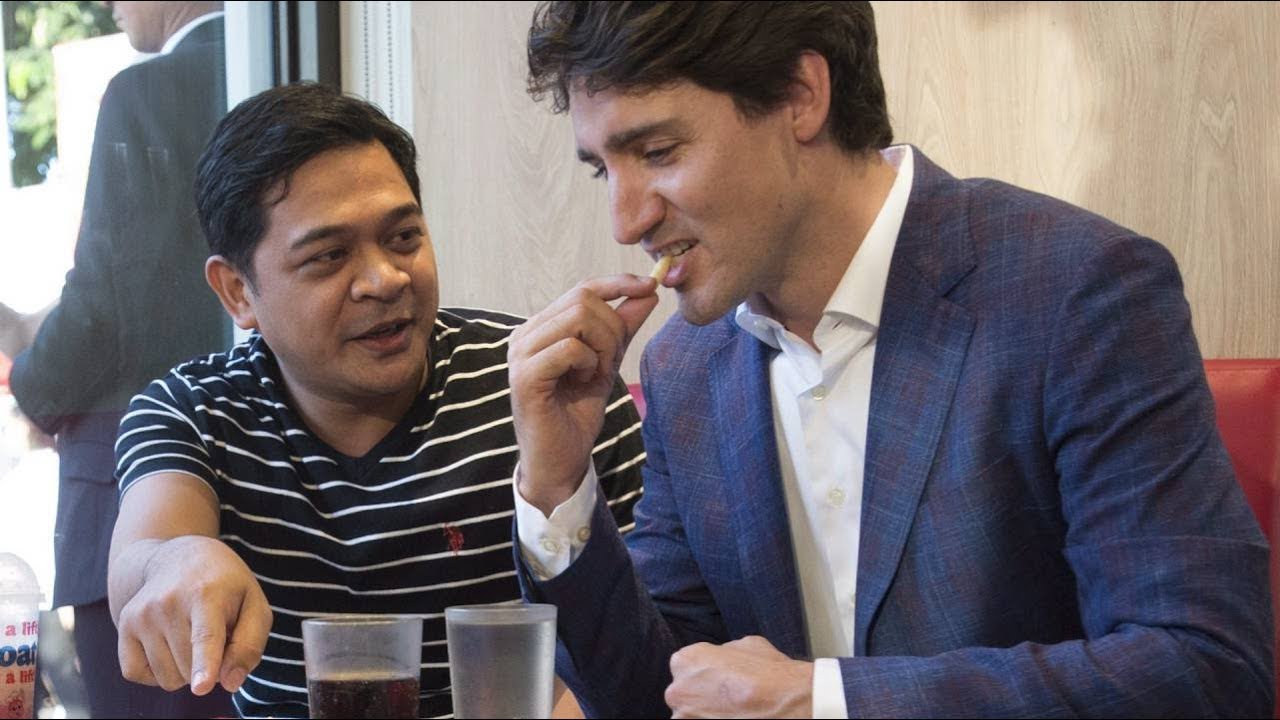 Trudeau snacks on fries at Manila Jollibee restaurant