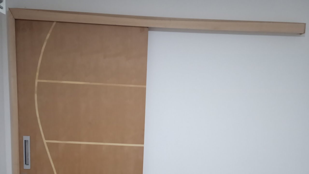 Como instalar porta de correr de madeira
