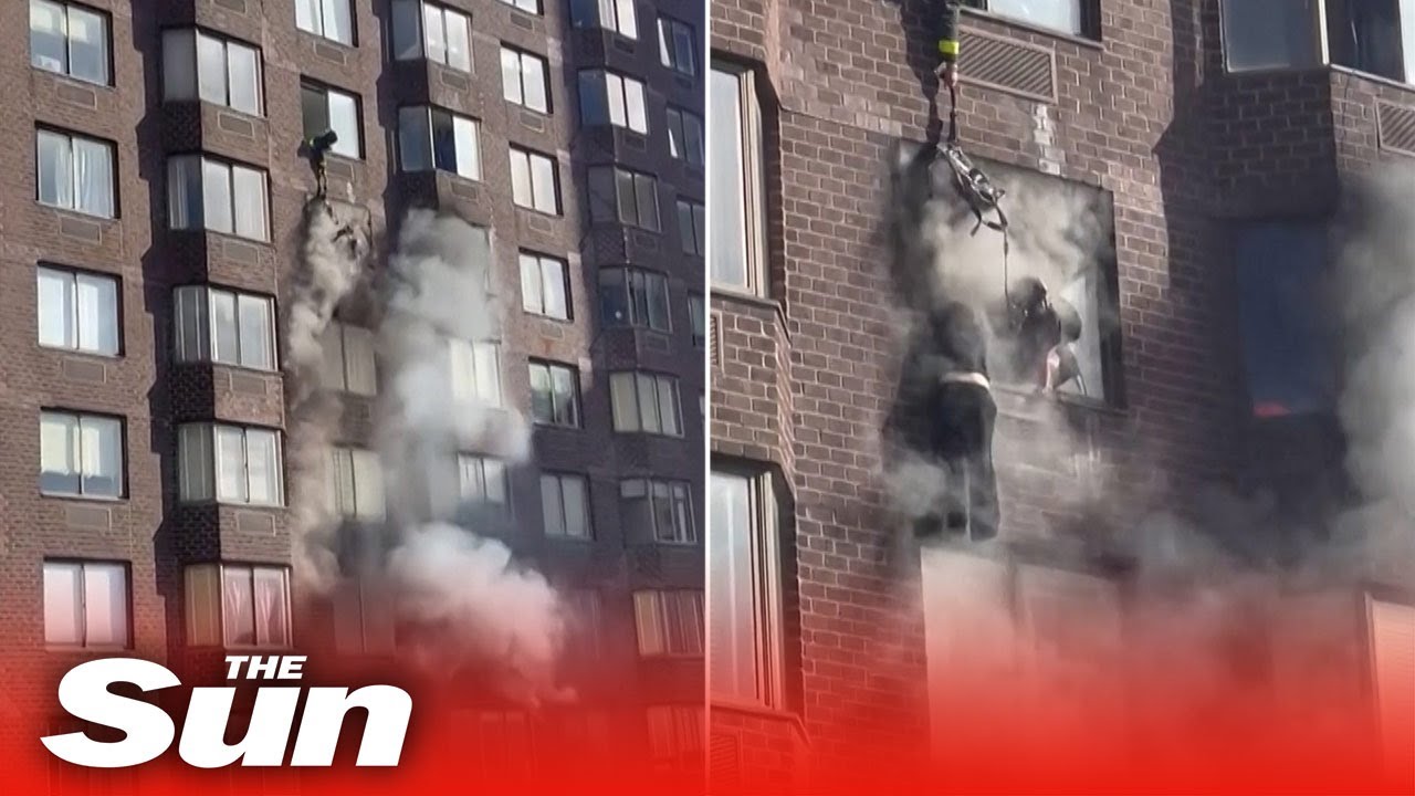NYC firefighters rescue woman dangling from window during apartment blaze