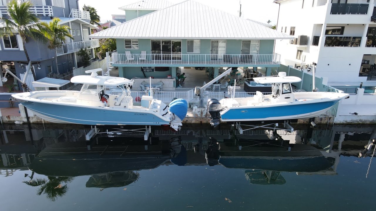 FINALLY I HAVE BOTH BOATS ON THE LIFT COBIA & SEA HUNT