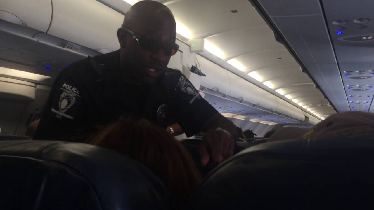 Lady Fights Police On American Airlines Flight Part 1