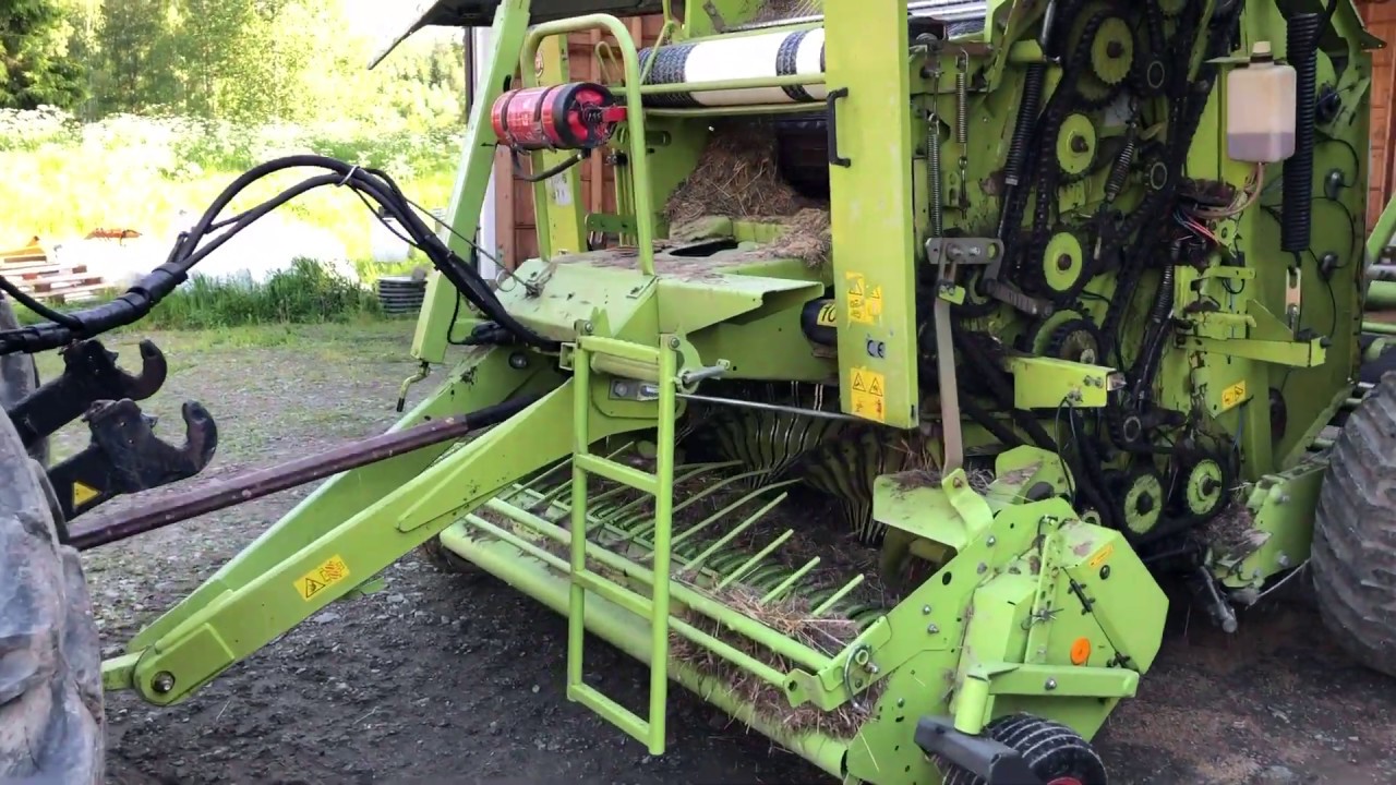 Köp Rundbalpress Claas Rollant 255 roto cut Uniwrap på Klaravik