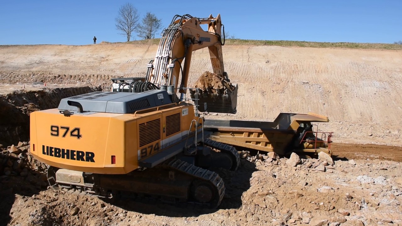 Liebherr R974C loading Cat 769C, 769D and 770 - Part 3