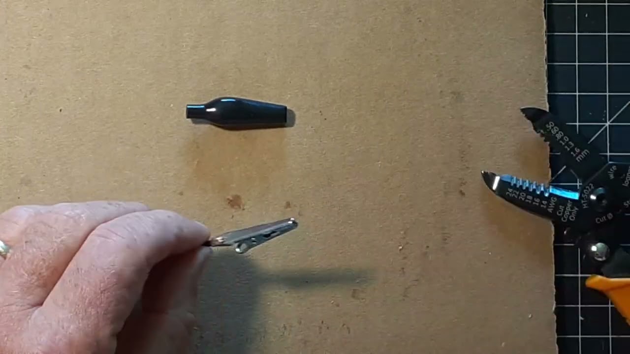 Attaching a new alligator clip to wire with soldering iron