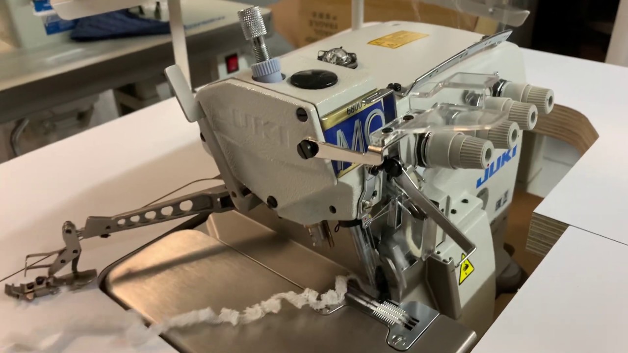 Juki 6814 2 Needle 4 Thread Overlock with Elastic Attachment. Complete with table stand and Motor.