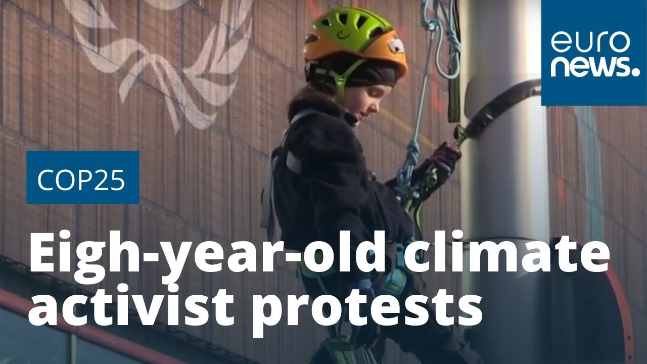 Eight-year-old climate activist climbs lamp post to protest outside COP25