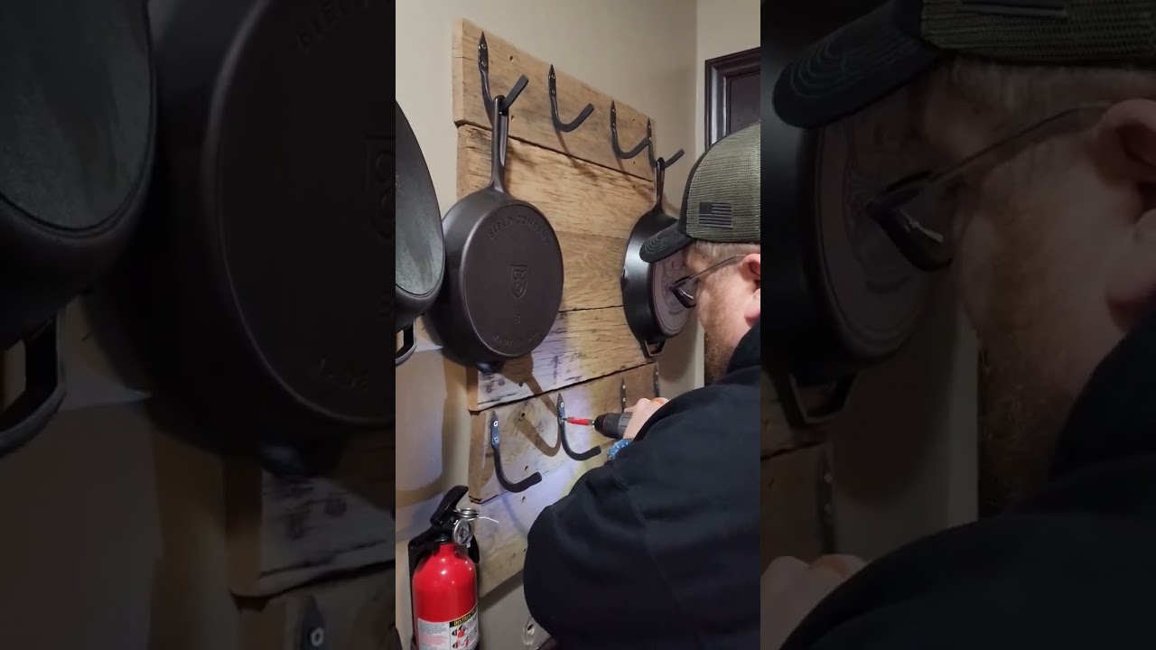 Reclaimed wood wall with hand forged hooks for cast iron skillets. #shorts