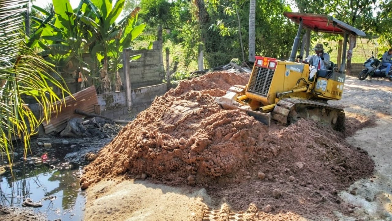 Cleaning up trash and mud in the backyard