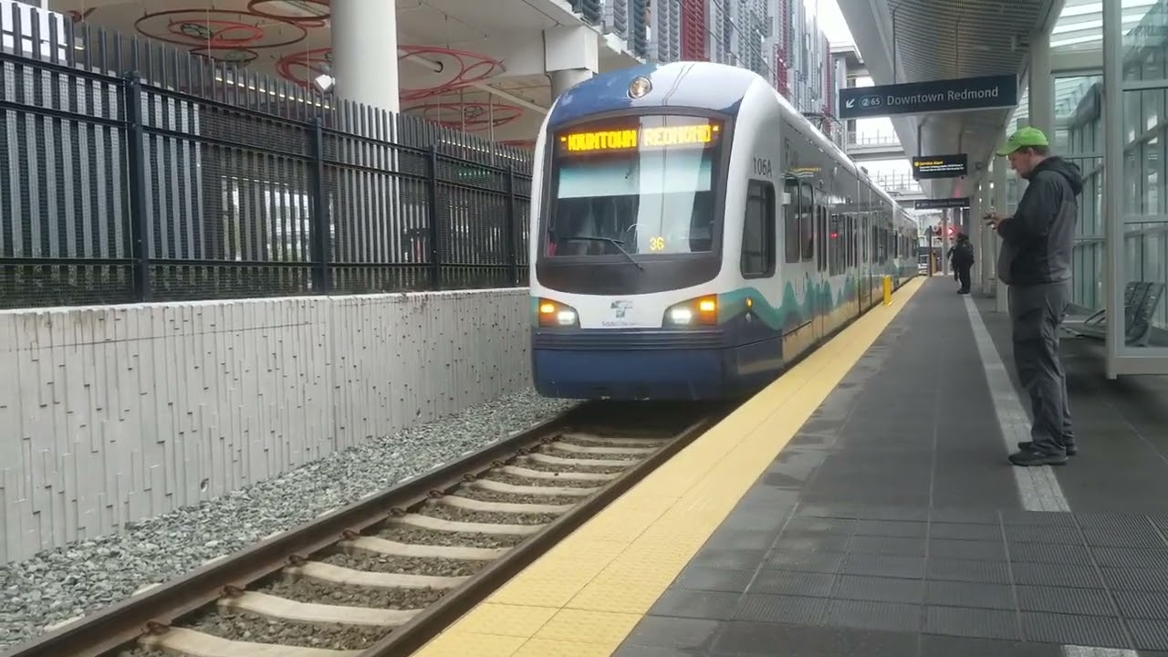 Link light rail train arrives and departs from 