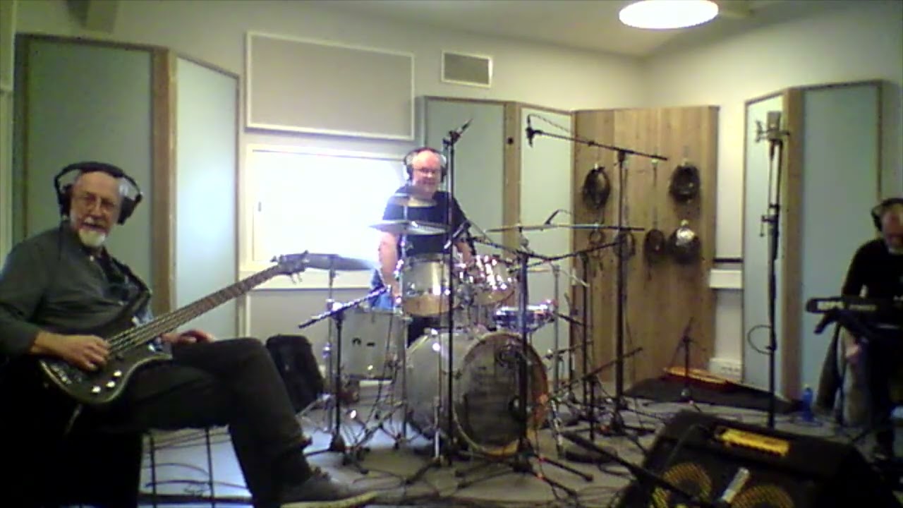 Band working in studio