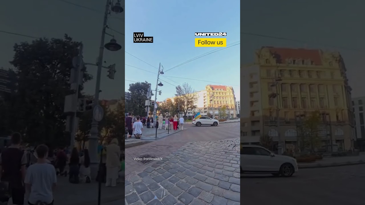 Ukrainian Civilians Stop to Pay Respects to Fallen Ukrainian Heroes #warinukraine
