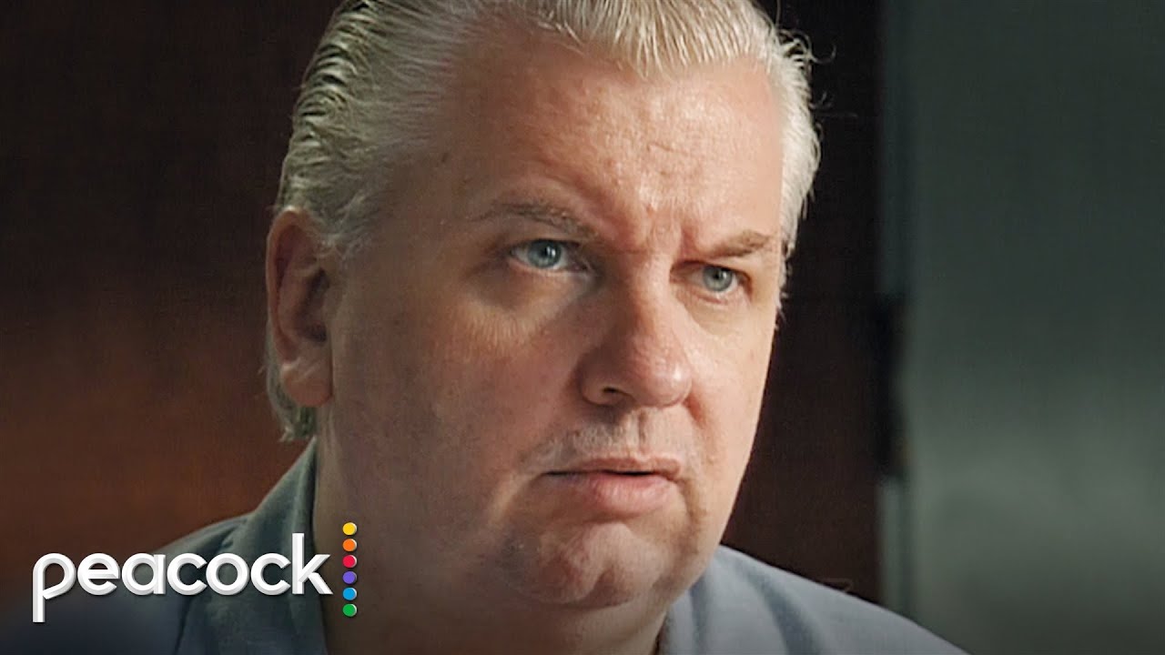 John Wayne Gacy Looks at Victim Photos: 