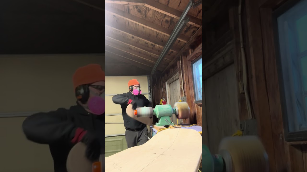 Drum sanding skateboards. 