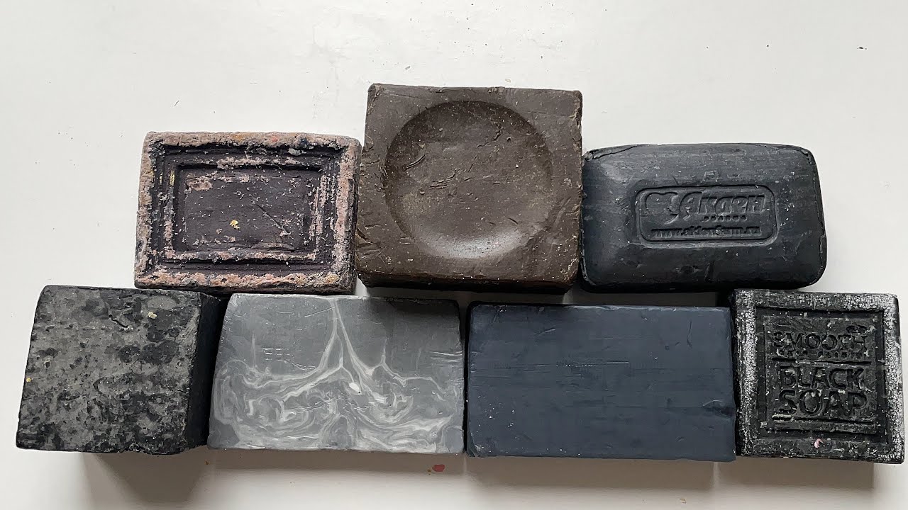 Cutting soft black and brown soap