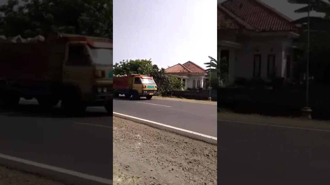 truk dump kepala kuning muatan batu 