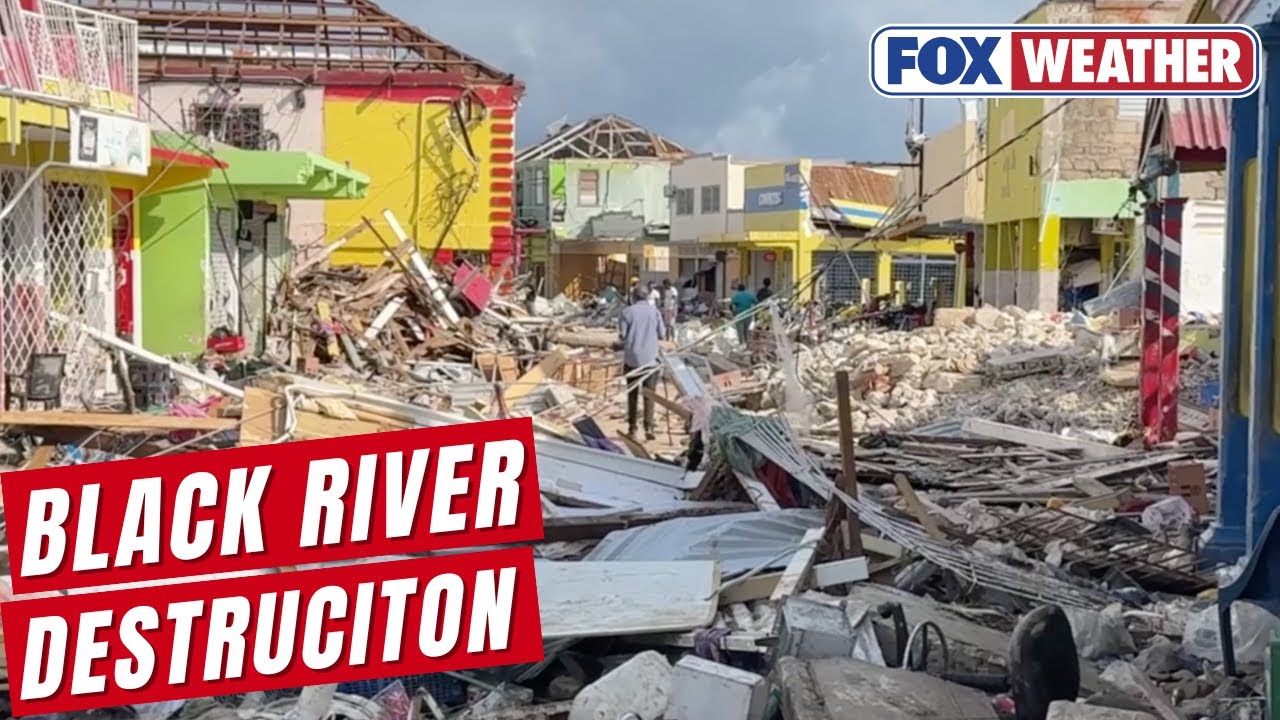 Trudging through rubble amid devastation from Hurricane Melissa in Black River, Jamaica.