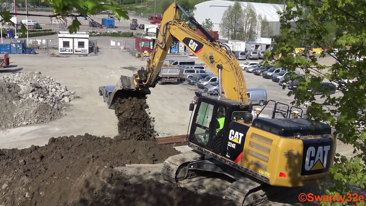 4K| CAT 324E Excavator Digging And Moving Dirt