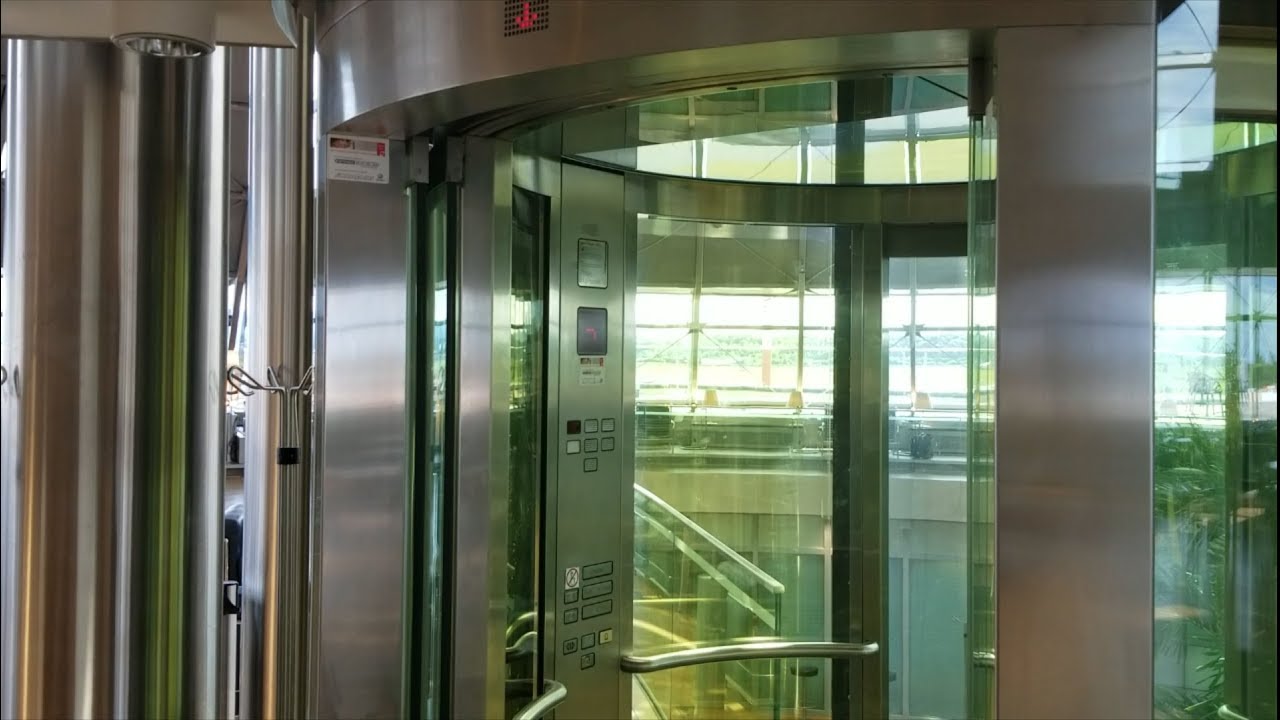 Phenomenal Cylindrical Glass Schindler M-Series Hydraulic Elevator at EuroAirport in France