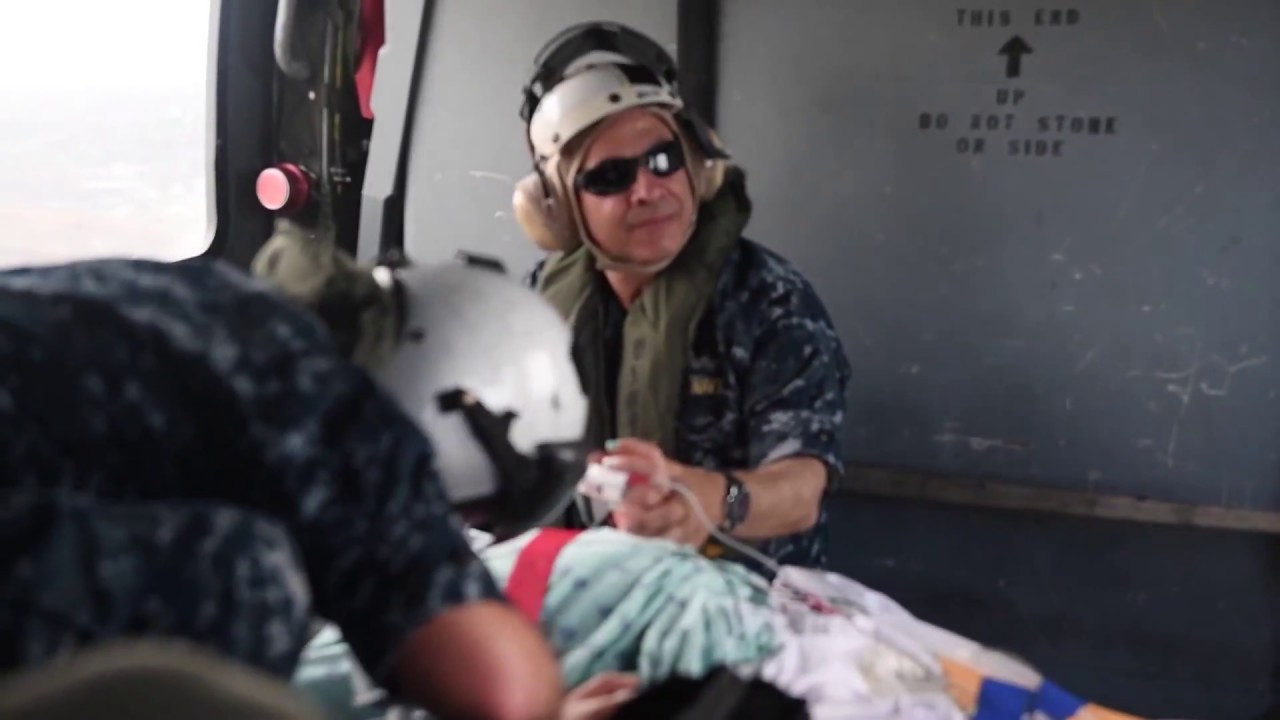 USNS Comfort Helo Transports Patient From Shore to Ship For Care