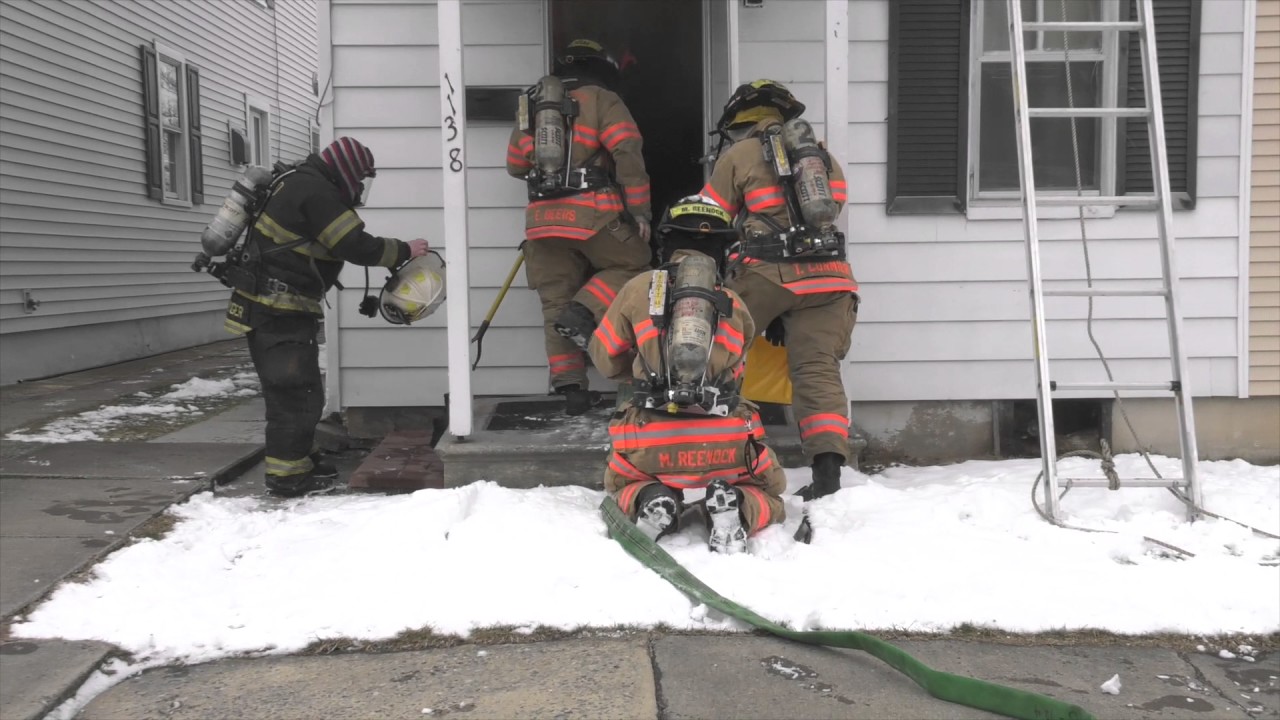 Arrival Video: firefighters stretching in on a house fire  03/12/17