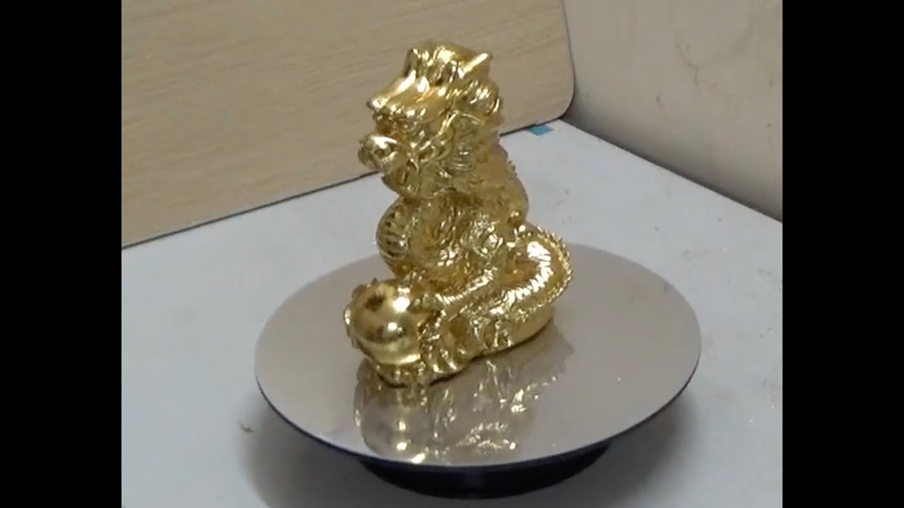 Gold leaf applying for Copper Dragon Statue (Dát vàng cho tượng rồng bằng đồng)