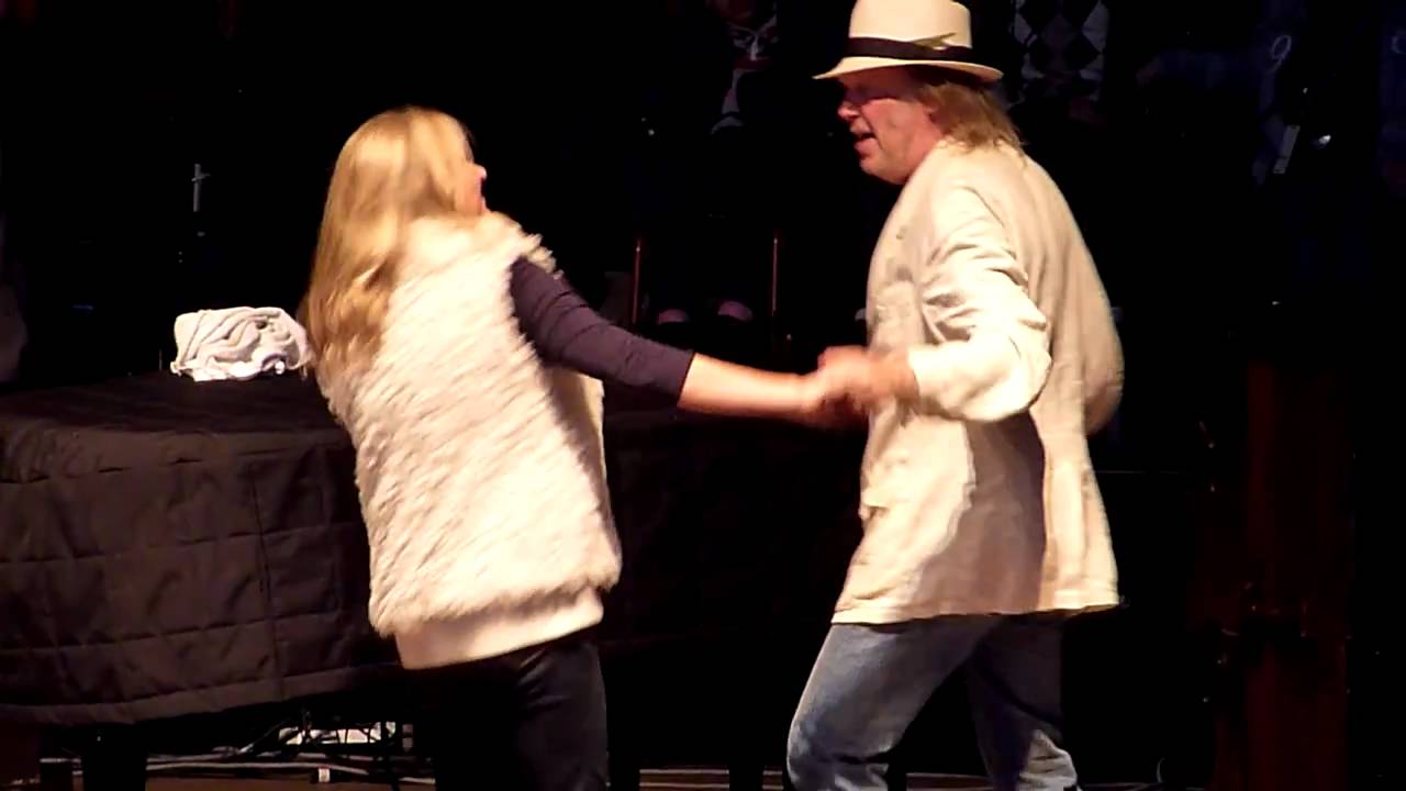 Neil and Pegi dancing in the streets