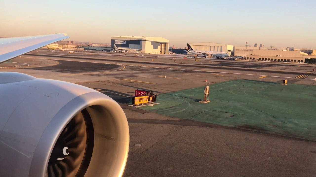 United Airlines NEW Polaris B777-300 sunrise takeoff from EWR.