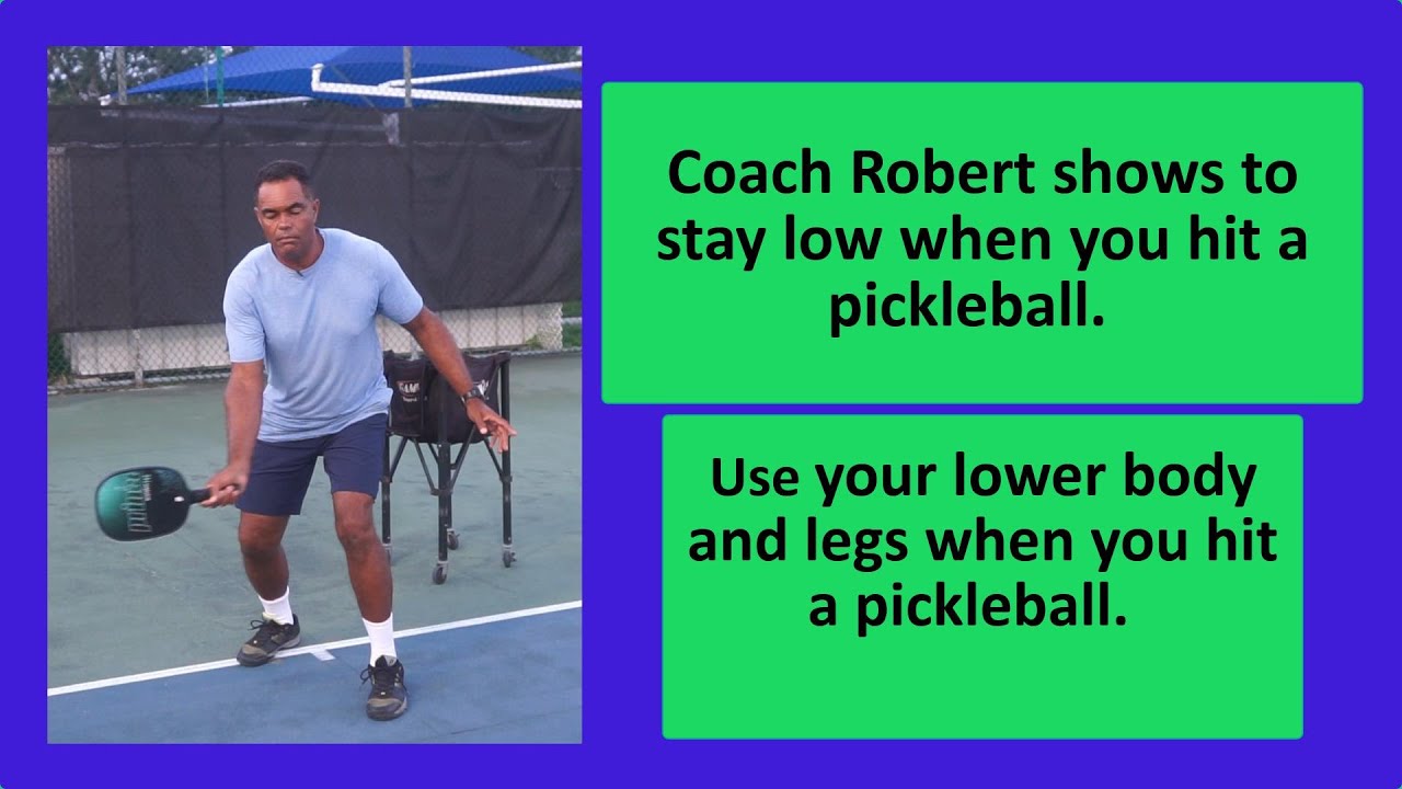 61 Coach Robert shows to stay low when you hit a pickleball.
